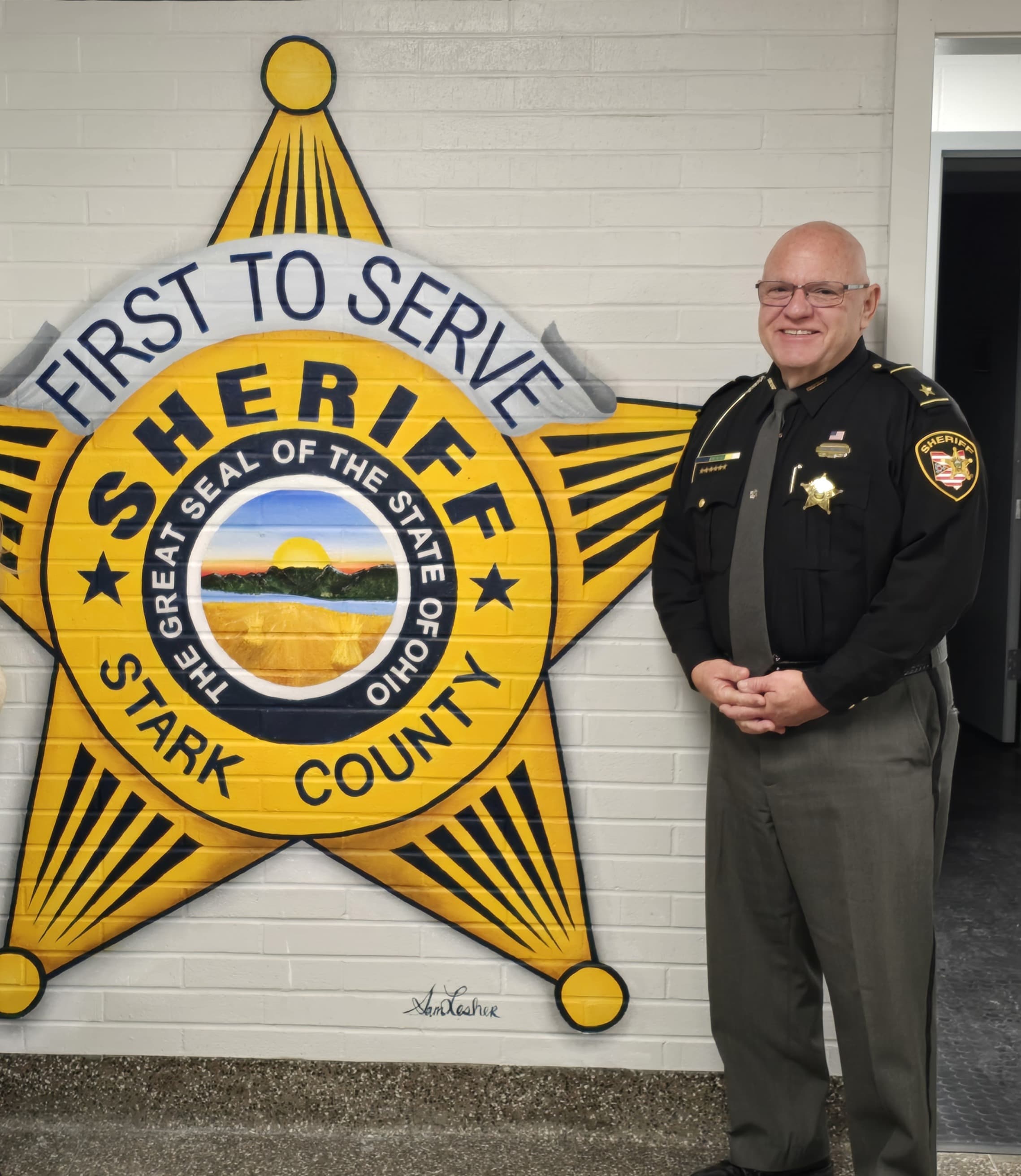 Sheriff Eric Weisburn beside the Stark County sheriff star