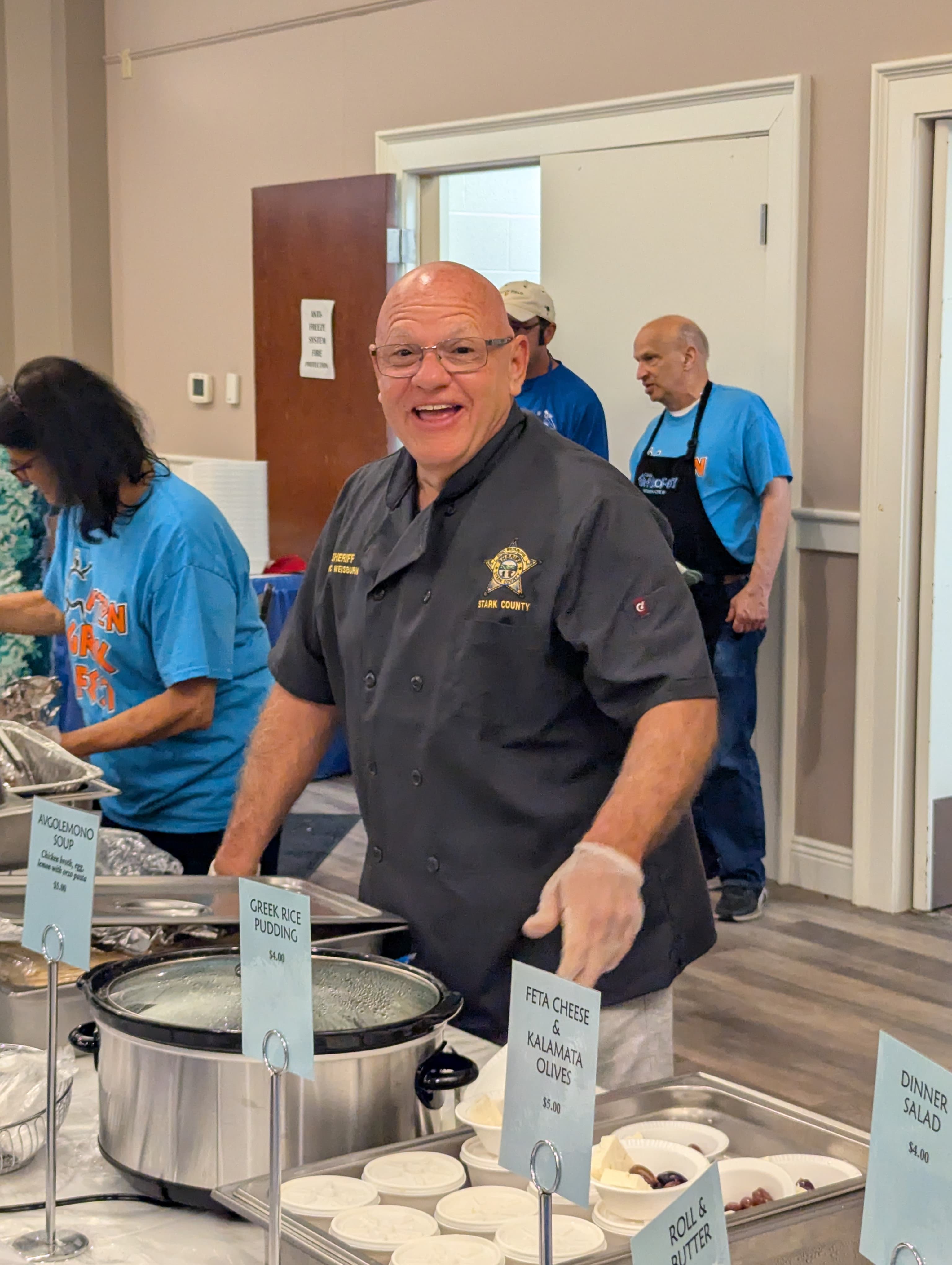 Sheriff Weisburn serving at the Stark County Greek Festival